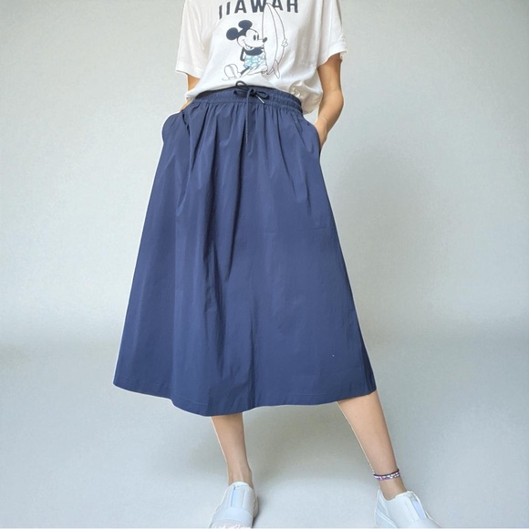 New Balance Dresses & Skirts - New Balance Deep Blue Midi Skirt Elastic Waist Pockets All Day Wear NWT XS